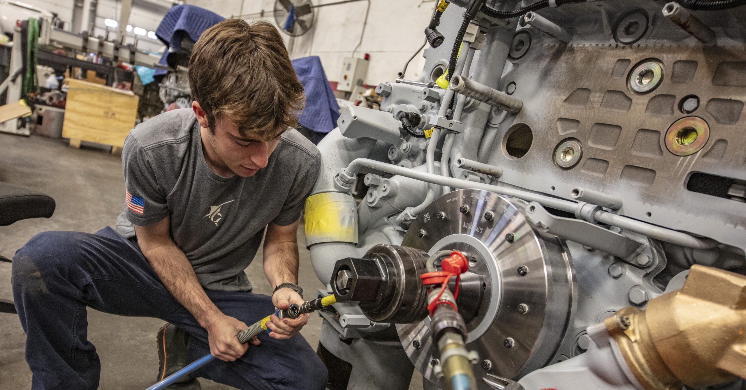 technician working on a marine engine.